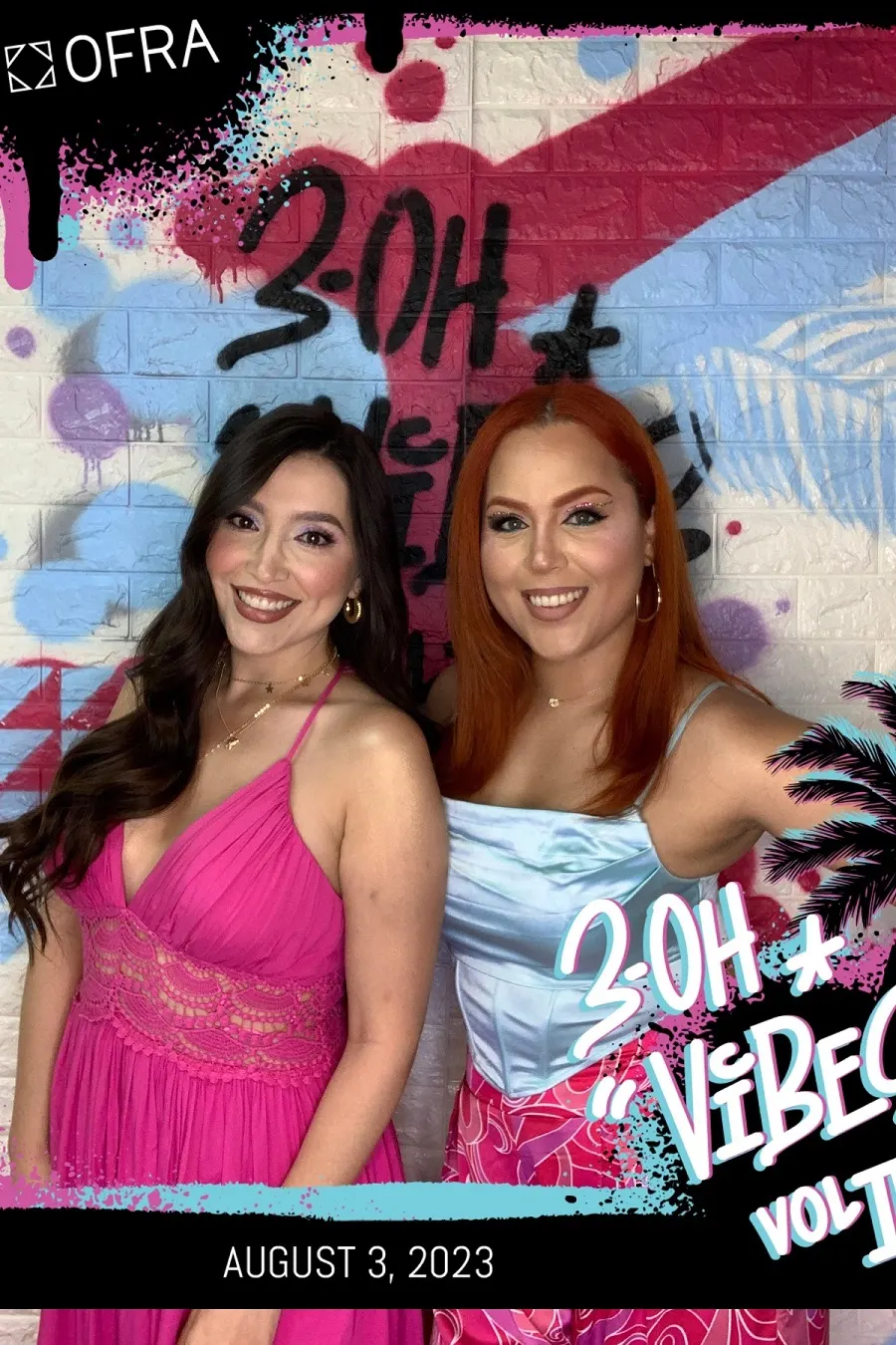 Two friends in a colorful birthday photo booth print