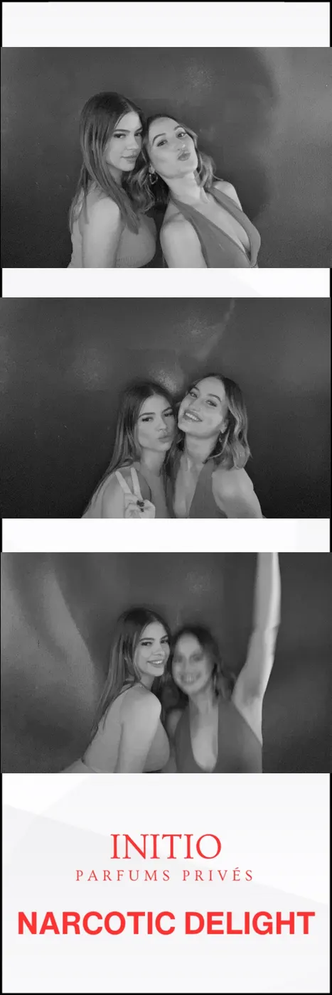 Black and white photo booth strip of two friends