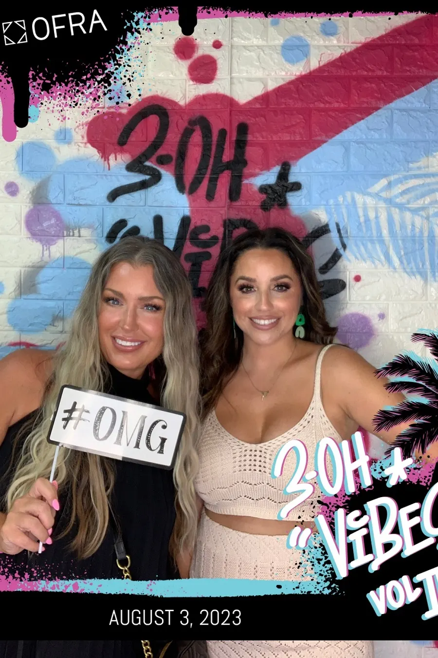Friends celebrating in a colorful photo booth print