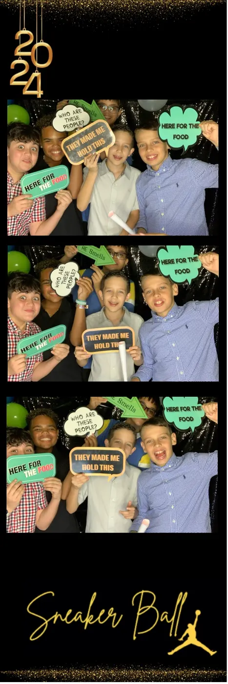 Kids with props in photo booth print strips
